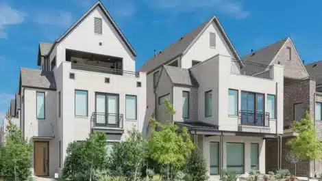 Close-up porch entrance of brand new row of three-story single-family houses in Richardson, North Dallas