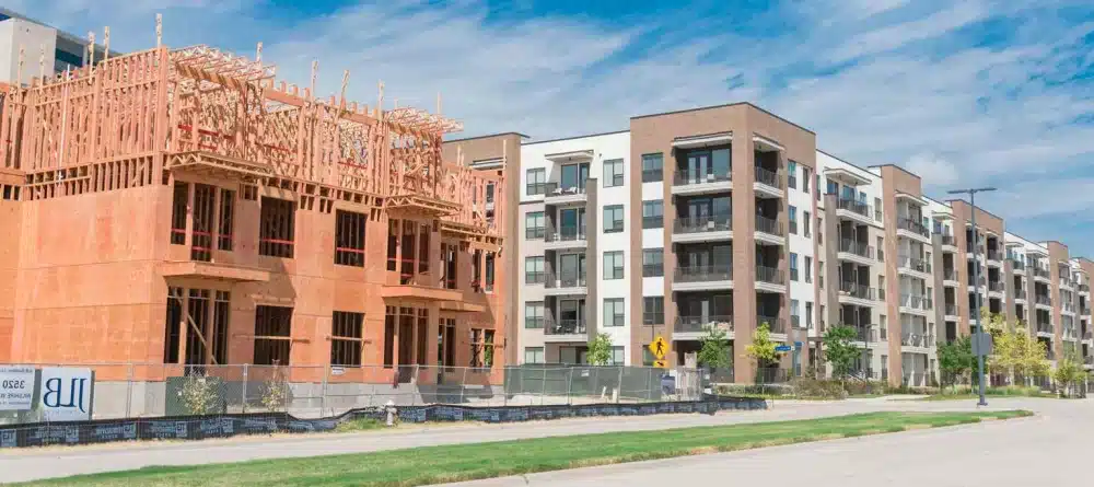Panoramic view of street side development neighborhood with rental units under construction