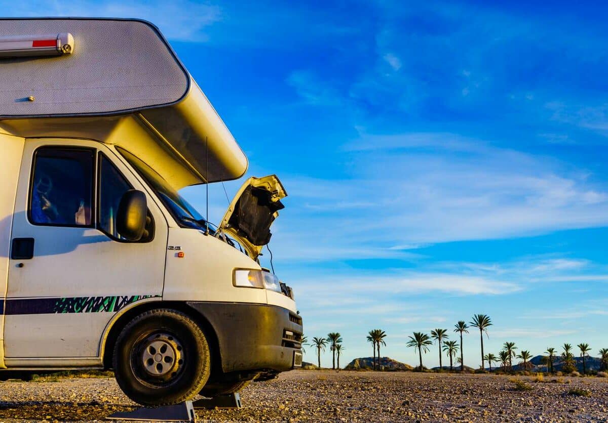 An RV getting engine Maintenance on the side of the road in Florida.