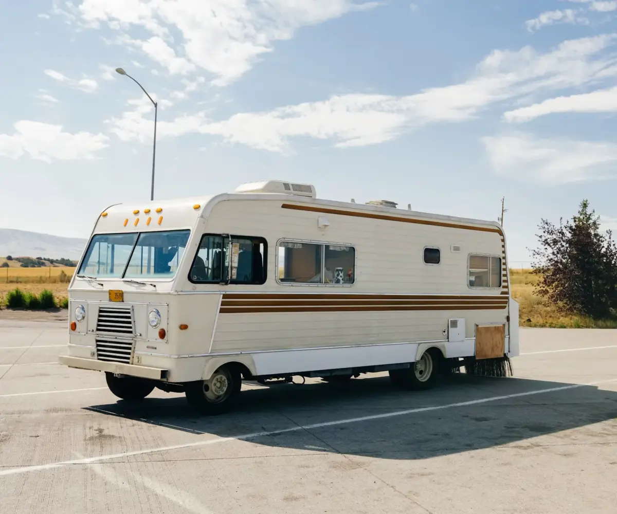 Property manager overseeing RV and boat storage facility, checking units and speaking with a tenant to ensure smooth operations and secure access
