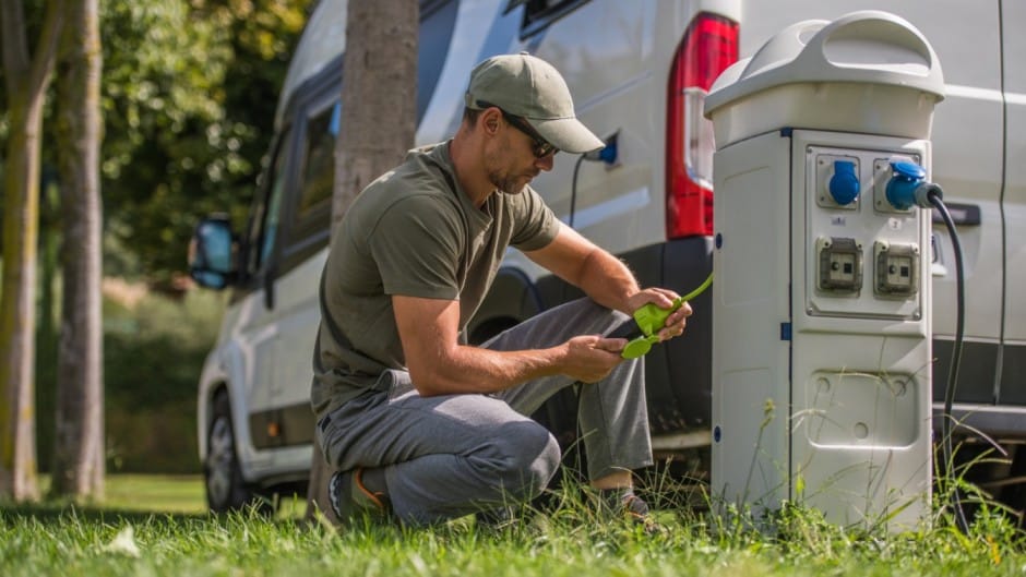 man plugging in his rv