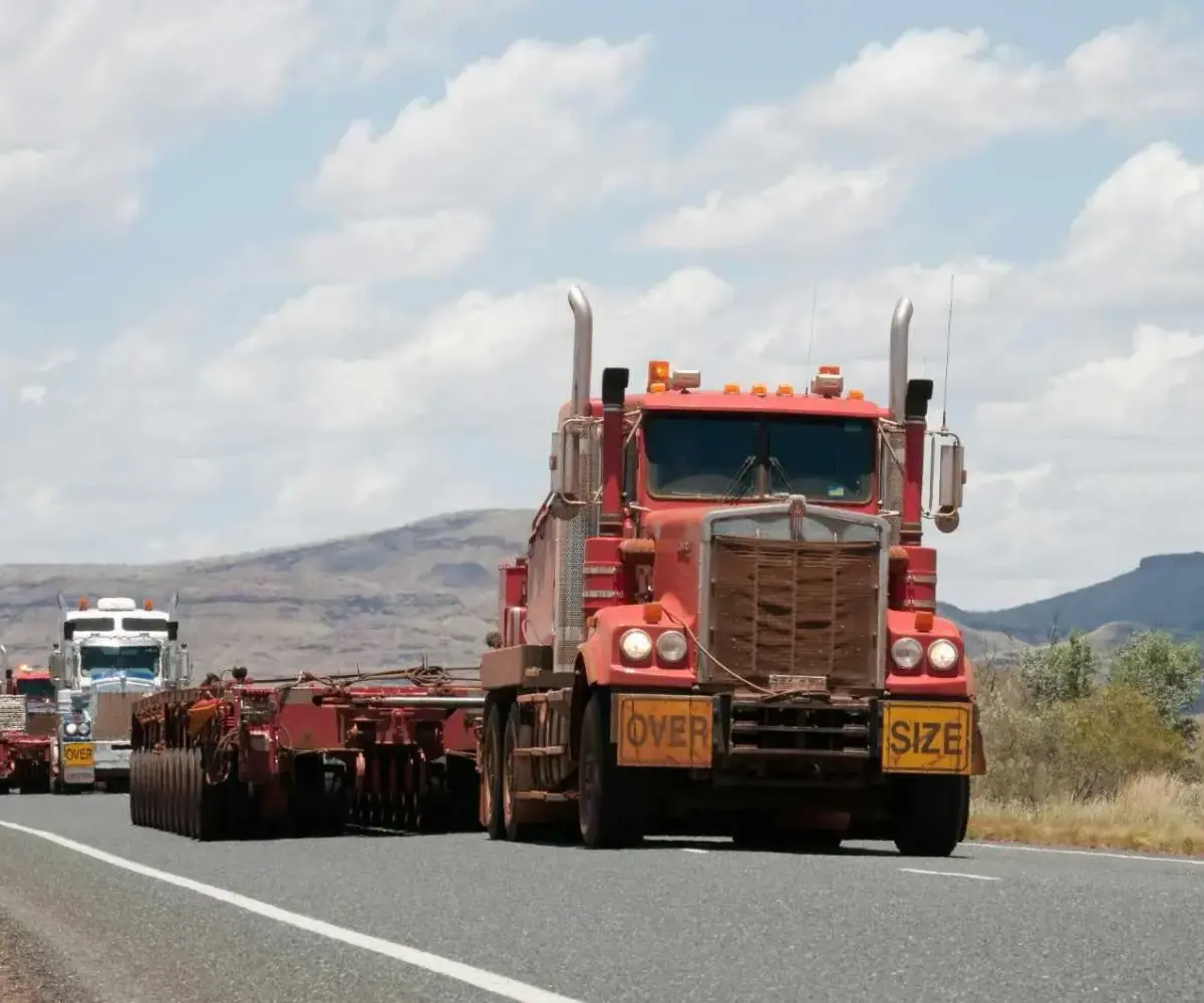 Trucks driving on a highway.