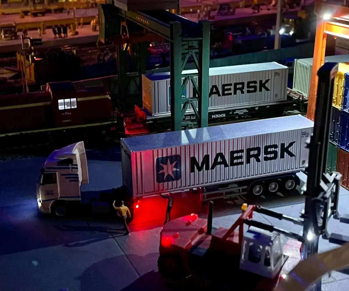 Container truck in a shipping terminal parking area.