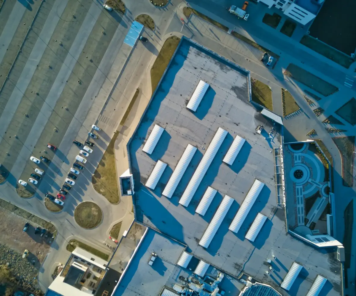Aerial view of a large commercial facility with outdoor storage areas.