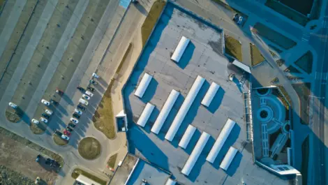 Aerial view of a large commercial facility with outdoor storage areas.