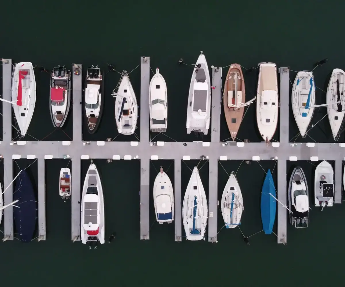 Top-down view of boats docked at a marina.