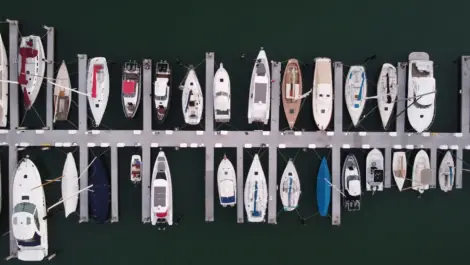 Top-down view of boats docked at a marina.