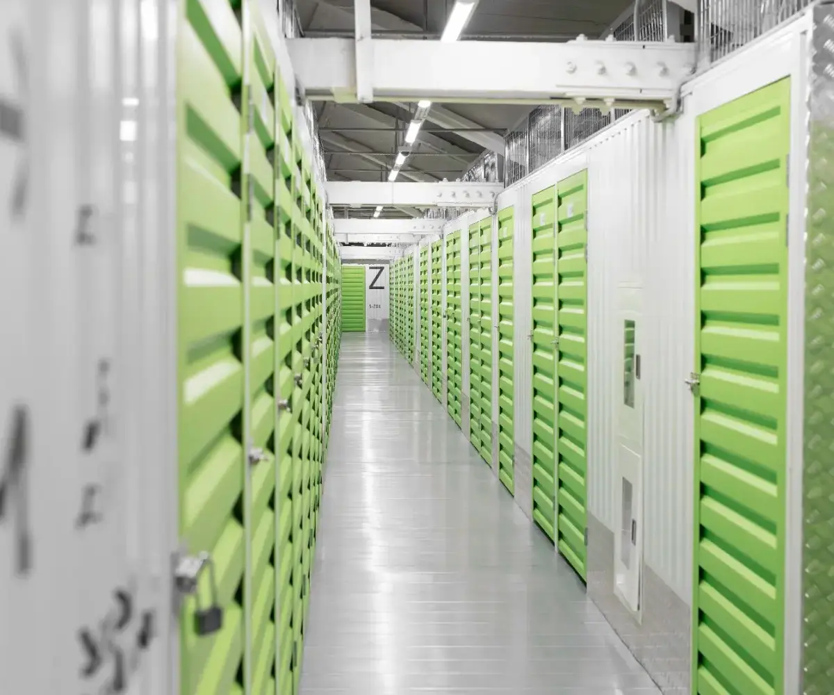 Self-storage containers lined up in a container warehouse.