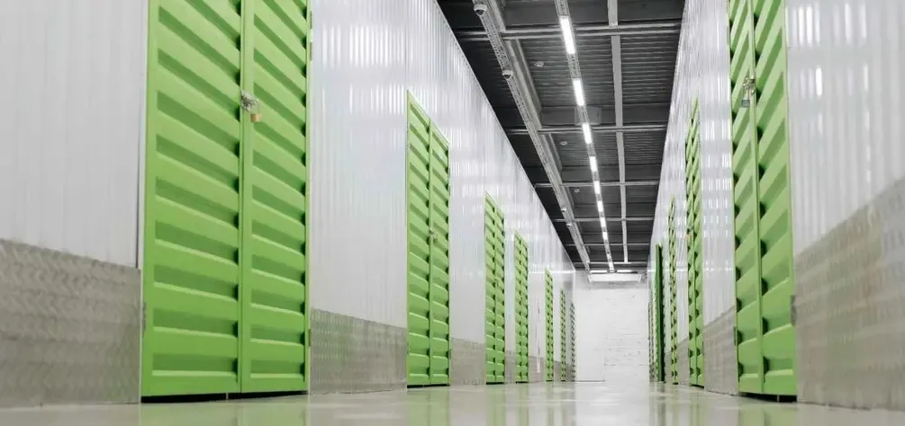 indoor hallway with green storage unit doors