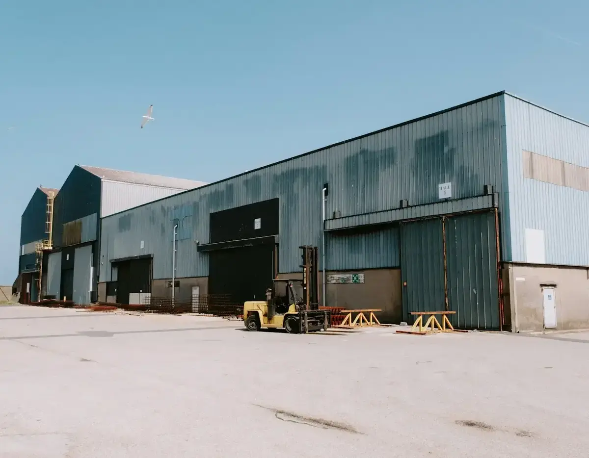 Large industrial warehouse with outdoor storage.