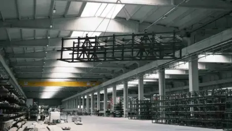 large industrial warehouse lifting steel frame