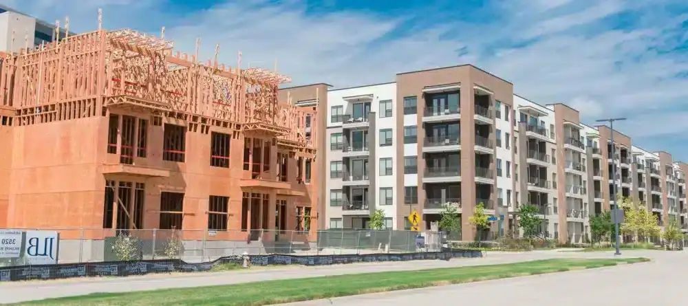 Panoramic view of street side development neighborhood with rental units under construction