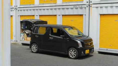 Car parked outside storage unit facility