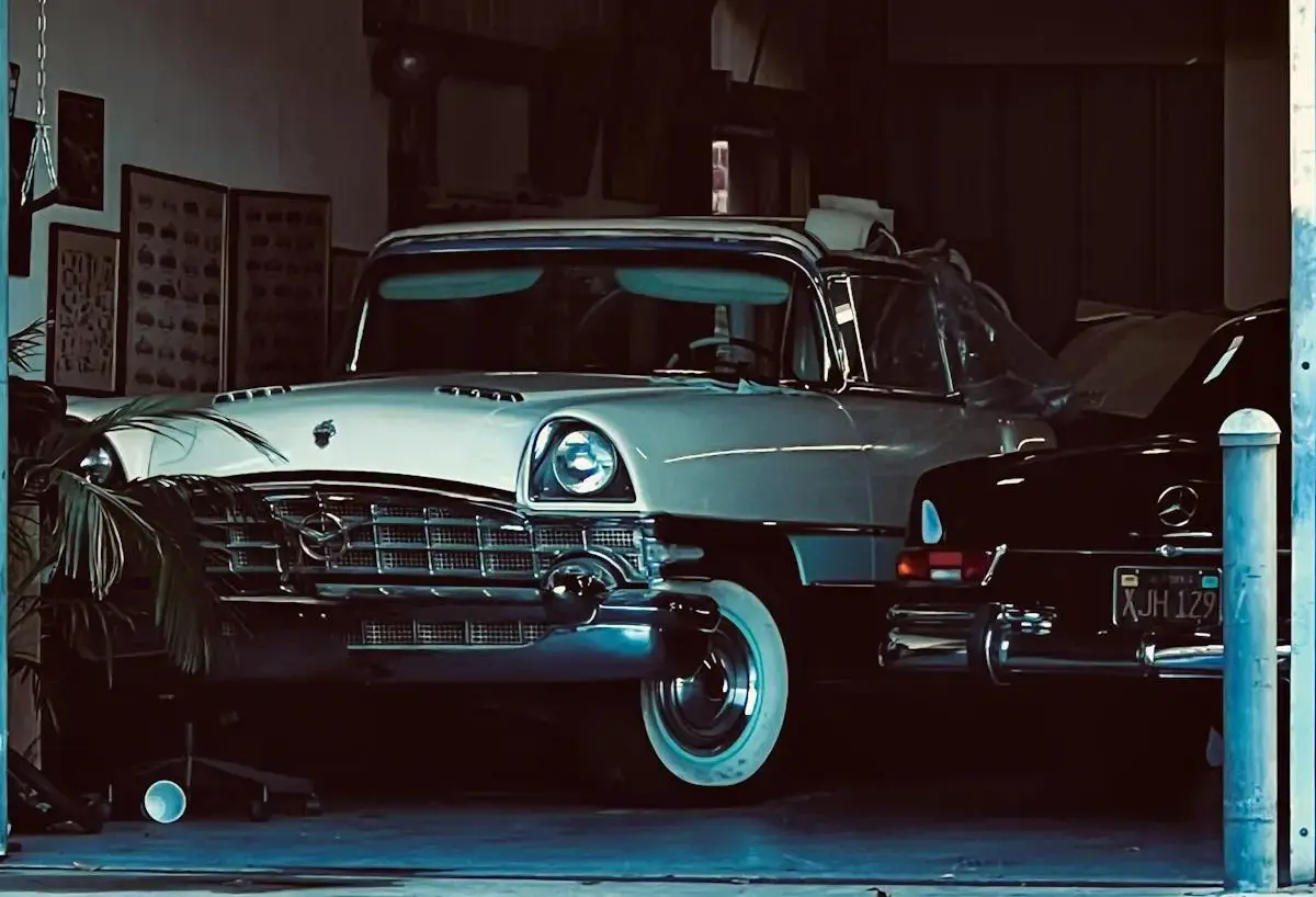 Classic vintage car parked inside a dimly lit garage