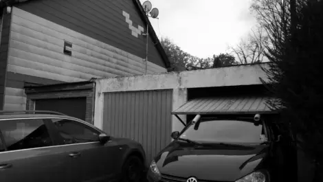Cars parked in residential garage area.