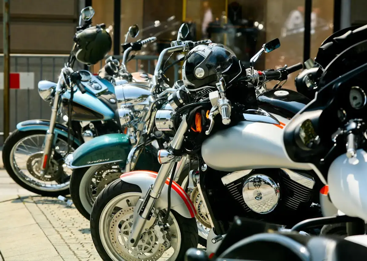Multiple motorcycles parked in a storage facility, illustrating different storage options and pricing considerations.