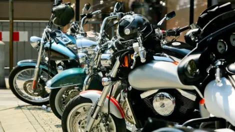 Multiple motorcycles parked in a storage facility, illustrating different storage options and pricing considerations.