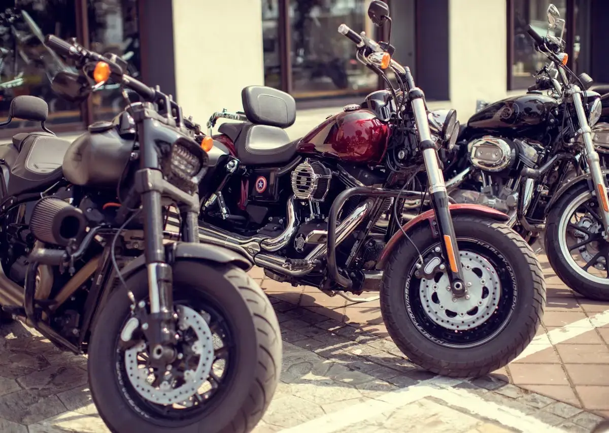 Multiple motorcycles parked outdoors in a row, illustrating public storage demand, parking considerations, and motorcycle space requirements.