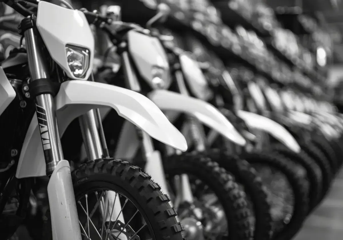 Motorcycles lined up in indoor storage, highlighting protected environments that prevent moisture damage, theft, and long-term wear.