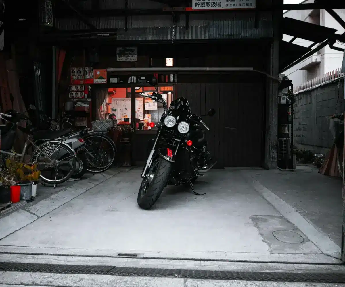 Motorcycle parked in a garage during storage, illustrating proper long-term storage conditions and maintenance considerations.