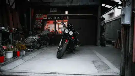 Motorcycle parked in a garage during storage, illustrating proper long-term storage conditions and maintenance considerations.