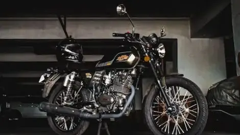 Motorcycle parked inside a storage unit or garage, showing safe indoor storage to protect against weather and theft.