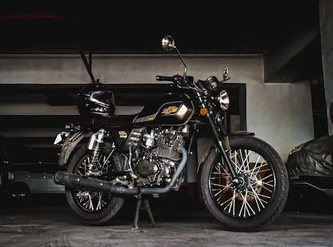 Motorcycle parked inside a storage unit or garage, showing safe indoor storage to protect against weather and theft.