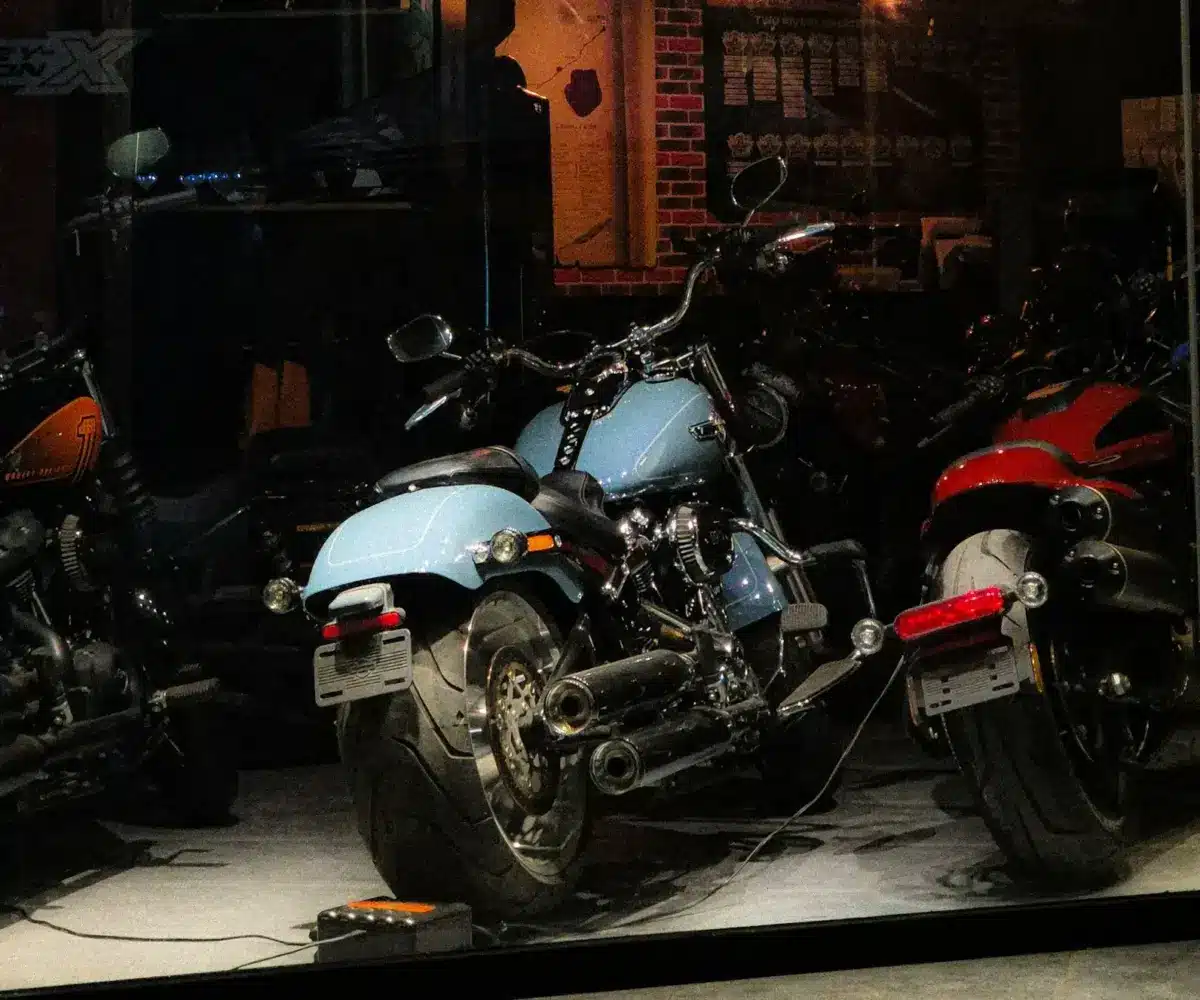 Motorcycles stored indoors in a garage, illustrating fuel system care and proper storage setup during long-term downtime.